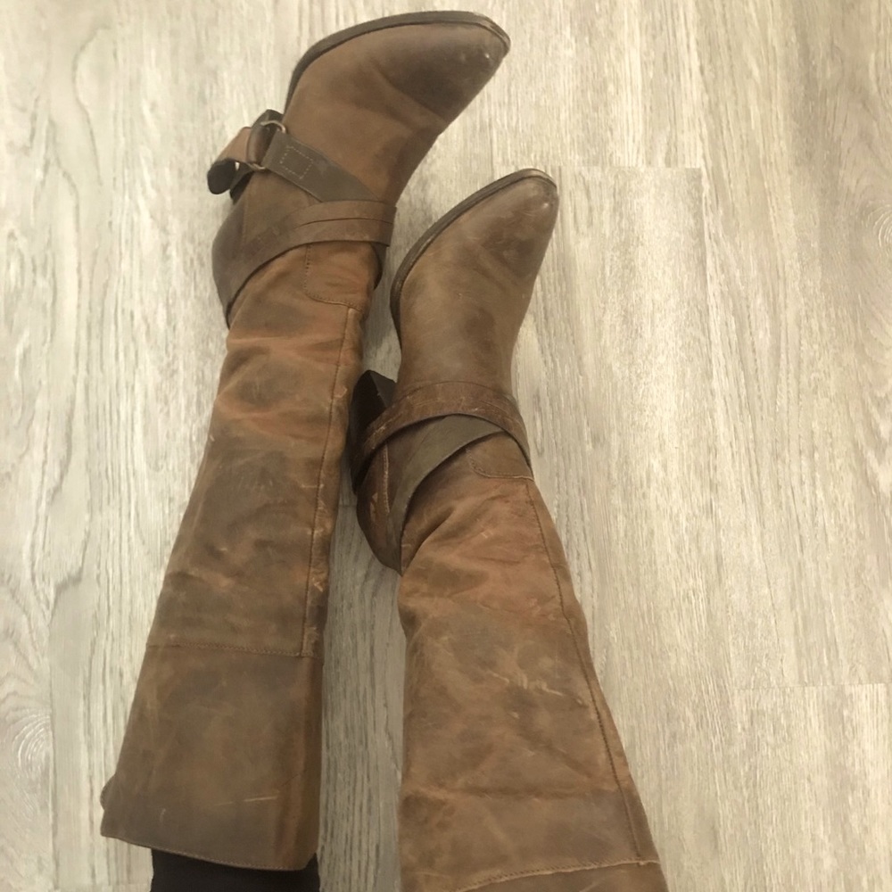 Knee high “Rockie” brown leather boots.